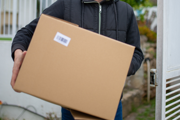 A cardboard box being carried.