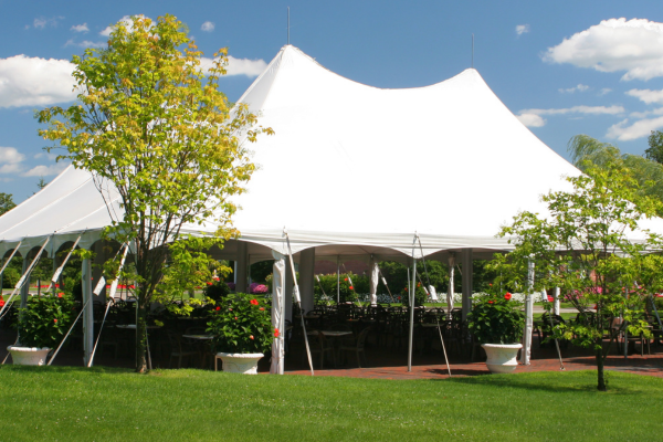 Event tent setup outdoor on a clear day.